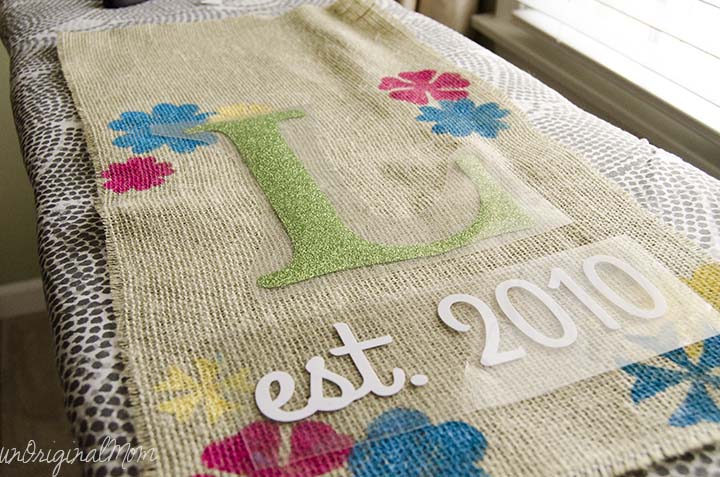 A "rustic glam" burlap garden flag with glitter heat transfer vinyl!