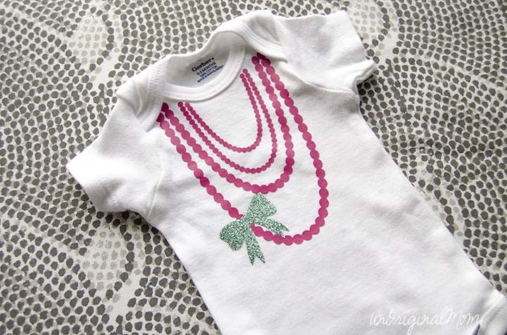 Glamorous, glitzy, and girly onesie made with heat transfer vinyl.