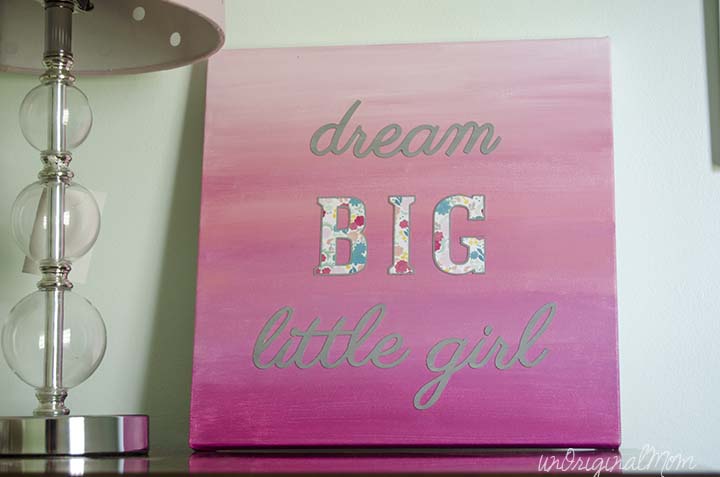 A painted ombre canvas with chipboard letters create this simple "Dream Big Little Girl" canvas art!