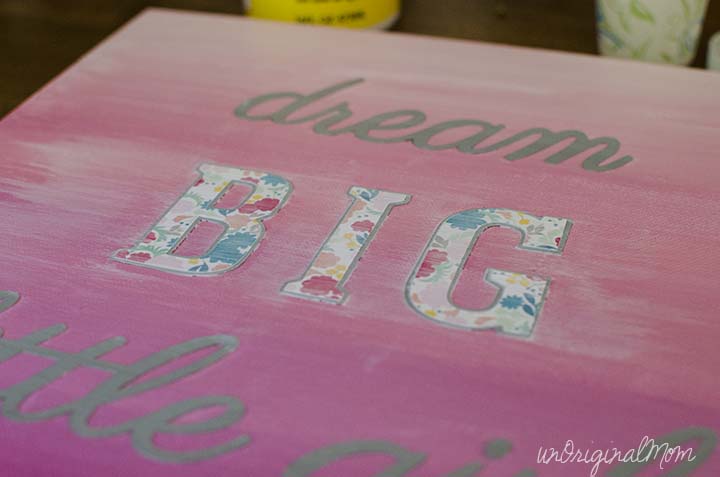A painted ombre canvas with chipboard letters create this simple "Dream Big Little Girl" canvas art!