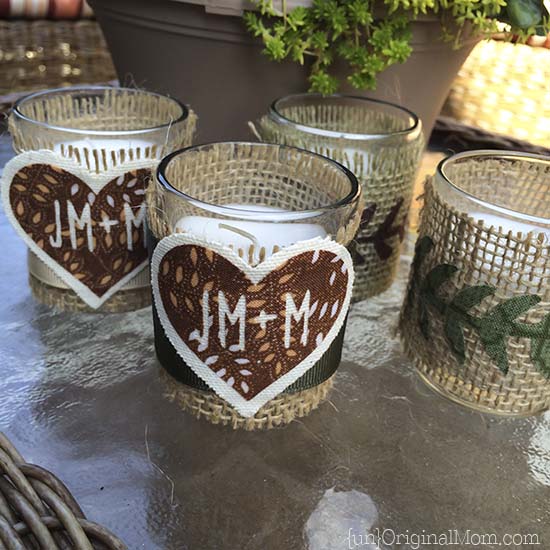 Step by step tutorial to create burlap wrapped votives with iron on fabric accents - perfect for a woodland wedding or shower