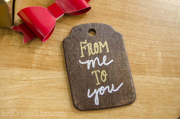 Rustic stained wood gift tags with metallic sharpie paint pens. A beautiful addition to holiday wrapping!