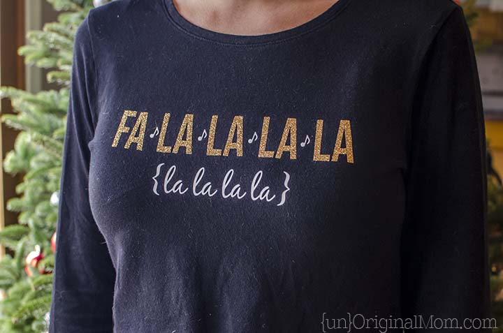 Glitter heat transfer vinyl "fa la la" Christmas shirt - so cute, and perfect for caroling or Christmas parties! Free cut file to make your own.