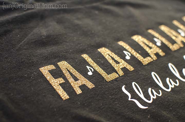 Glitter heat transfer vinyl "fa la la" Christmas shirt - so cute, and perfect for caroling or Christmas parties! Free cut file to make your own.