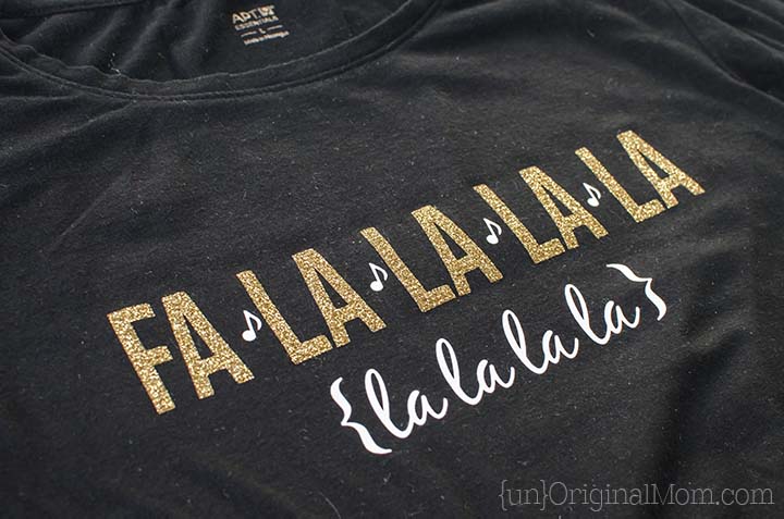 Glitter heat transfer vinyl "fa la la" Christmas shirt - so cute, and perfect for caroling or Christmas parties! Free cut file to make your own.