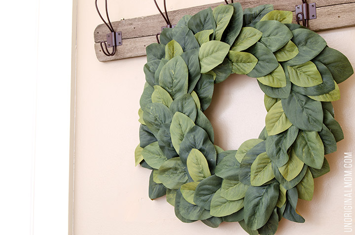 Great tutorial to make your own farmhouse style Magnolia Wreath for under $15! So much better than paying $100 for a store bought one. Love this Magnolia Market knockoff!