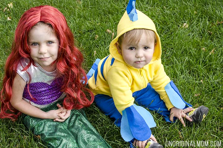 Adorable DIY Little Mermaid and Flounder costumes! The Ariel costume has a repositionable fin, and the no-sew toddler Flounder costume is super easy to make out of a yellow hoodie.