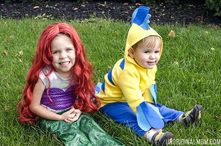 Adorable DIY Little Mermaid and Flounder costumes! The Ariel costume has a repositionable fin, and the no-sew toddler Flounder costume is super easy to make out of a yellow hoodie.