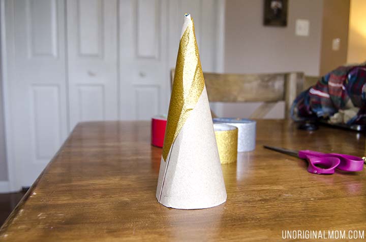 Make Christmas trees out of cereal boxes and duct tape! Super cheap Christmas decor, easy, and so pretty!