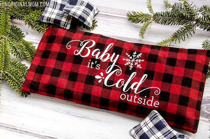 Love this easy DIY gift idea - make a flax seed foot warmer out of cozy flannel and personalize it with HTV. Free "Baby it's cold outside" Silhouette cut file, too!