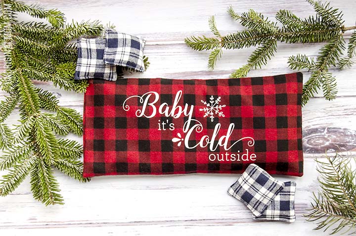 Love this easy DIY gift idea - make a flax seed foot warmer out of cozy flannel and personalize it with HTV. Free "Baby it's cold outside" Silhouette cut file, too!