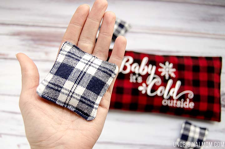 Love this easy DIY gift idea - make a flax seed foot warmer out of cozy flannel and personalize it with HTV. Free "Baby it's cold outside" Silhouette cut file, too!