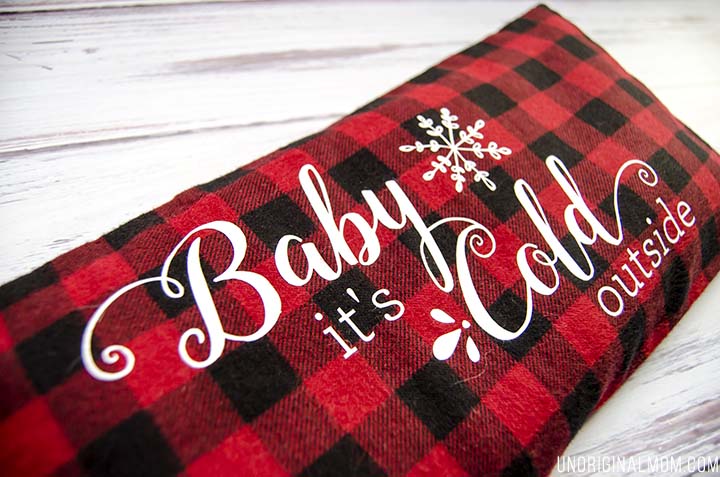 Love this easy DIY gift idea - make a flax seed foot warmer out of cozy flannel and personalize it with HTV. Free "Baby it's cold outside" Silhouette cut file, too!