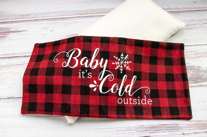 Love this easy DIY gift idea - make a flax seed foot warmer out of cozy flannel and personalize it with HTV. Free "Baby it's cold outside" Silhouette cut file, too!