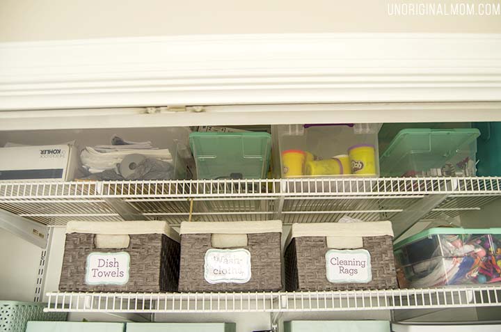 Organizing ideas and solutions for a small, multi-purpose laundry closet, complete with bins, labels, drawers, and even a pretty laundry sign!