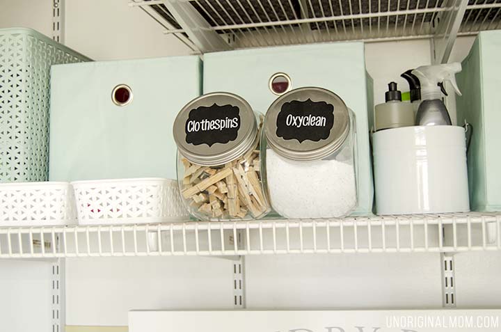 Organizing ideas and solutions for a small, multi-purpose laundry closet, complete with bins, labels, drawers, and even a pretty laundry sign!