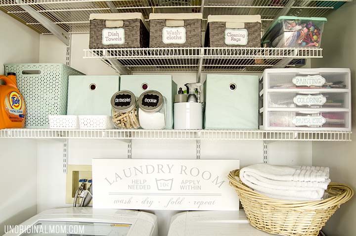 Organizing ideas and solutions for a small, multi-purpose laundry closet, complete with bins, labels, drawers, and even a pretty laundry sign!