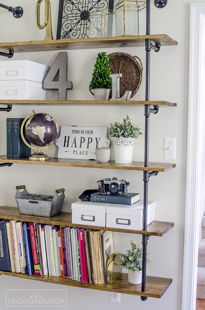 Pipe shelves for an industrial farmhouse office - such a great(and affordable) way to add a lot of style and character to a room! | industrial farmhouse pipe shelves | pipe shelving | fixer upper shelves | one room challenge