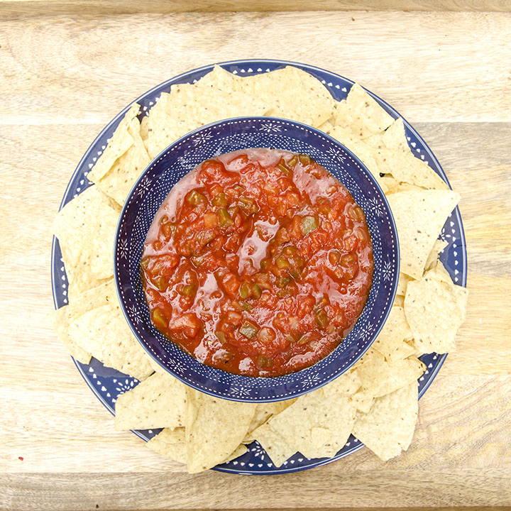 Easy DIY tiered chip and dip tray using a dollar store candlestick, clear Gorilla Glue, and a matching bowl and plate. | outdoor entertaining | chip and dip bowl | DIY tiered stand