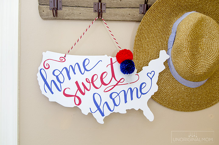 "Home Sweet Home" patriotic door hanger - perfect decor for the 4th of July! There's a free Silhouette cut file, too! | 4th of July | Patriotic decor | red white and blue decor | silhouette cut file | patriotic ideas with vinyl