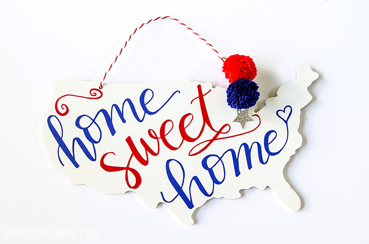 "Home Sweet Home" patriotic door hanger - perfect decor for the 4th of July! There's a free Silhouette cut file, too! | 4th of July | Patriotic decor | red white and blue decor | silhouette cut file | patriotic ideas with vinyl