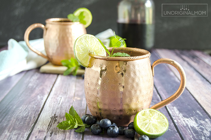 Blueberry Moscow Mule cocktail - a delicious summer drink made with blueberry simple syrup, lime juice, and ginger beer, and served in copper mugs. So refreshing and delicious! | blueberry cocktails | blueberry simple syrup | summer cocktail | summer drinks | copper mugs | blueberry moscow mule recipe