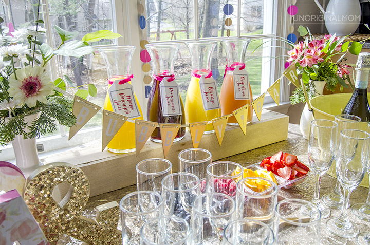 Great tips for how to put together a mimosa bar for a bridal shower or other event. It's easy and fun! | mimosa bar | mimosa bar printables | bridal shower brunch | bridal shower mimosa bar | brunch and bubbly | mimosa bar glasses | mimosa bar ideas