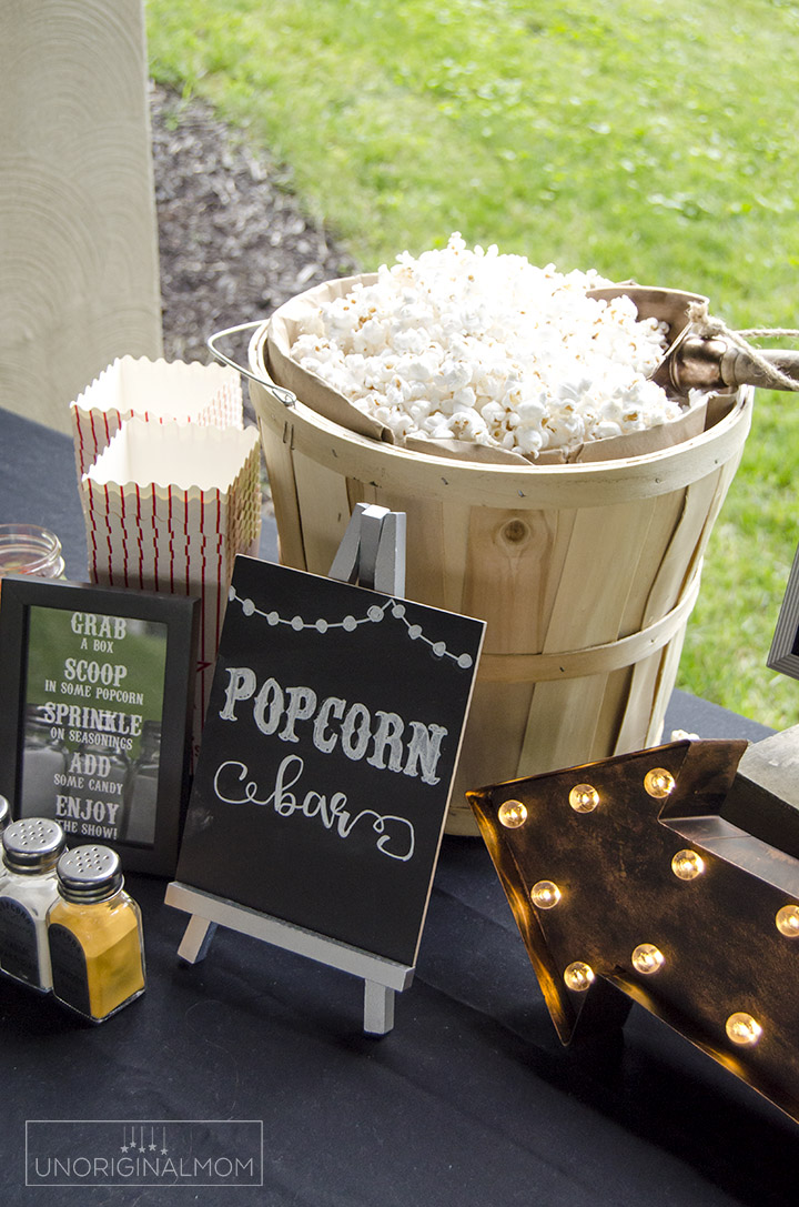 Super fun popcorn bar for an outdoor movie night - with printables and Silhouette cut files, too! | Popcorn bar printables | backyard movie night | movie party | chalkboard popcorn bar printables | movie night ideas | popcorn bar labels | movie night printables
