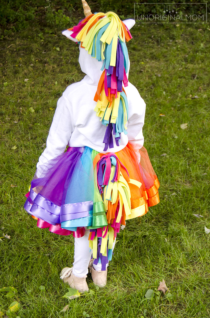 DIY Unicorn Hoodie Costume + Rainbow Tutu. Adorable unicorn costume made out of a hoodie! Love the rainbow tutu. Perfect for little girls. Make it no-sew by using hot glue instead! #unicorn #unicorncostume #easydiycostume