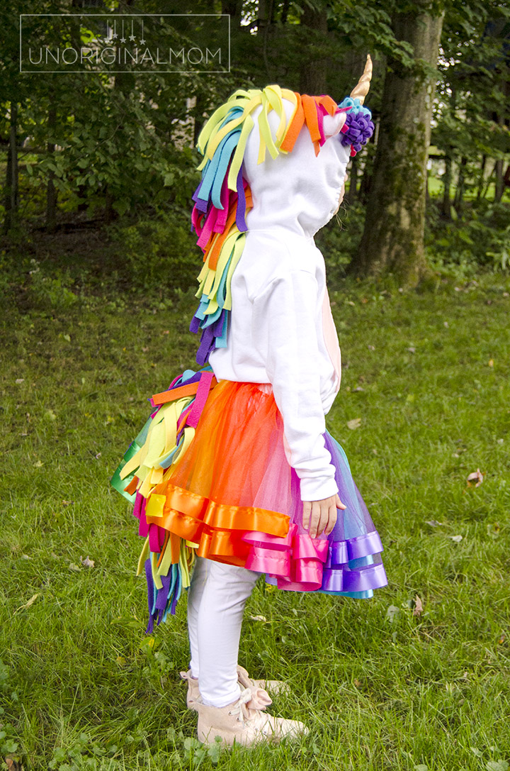 DIY Unicorn Hoodie Costume + Rainbow Tutu. Adorable unicorn costume made out of a hoodie! Love the rainbow tutu. Perfect for little girls. Make it no-sew by using hot glue instead! #unicorn #unicorncostume #easydiycostume