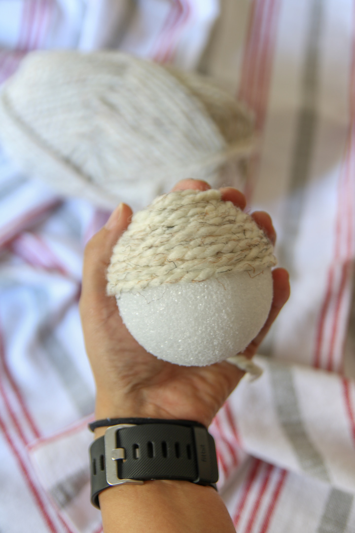 Quick and easy Christmas decor craft project - Christmas vase filler yarn balls! These are a cheap way to add to your Christmas decor on a budget!