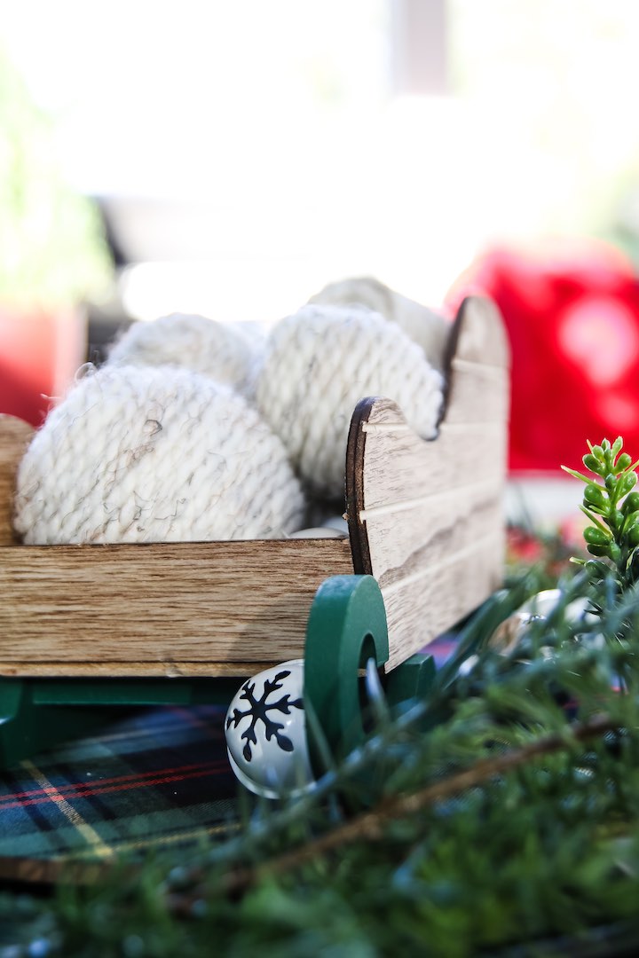 Quick and easy Christmas decor craft project - Christmas vase filler yarn balls! These are a cheap way to add to your Christmas decor on a budget!