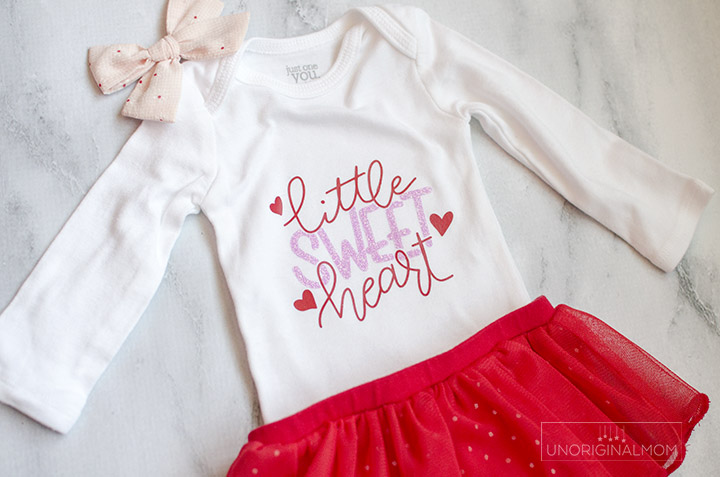 Little Sweet Heart Valentine's Onesie with a free cut file for Silhouette and Cricut! Use this adorable Valentine's onesie cut file to make a cute outfit for a little girl with glitter heat transfer vinyl.
