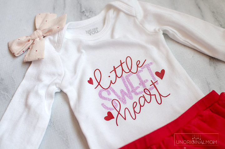 Little Sweet Heart Valentine's Onesie with a free cut file for Silhouette and Cricut! Use this adorable Valentine's onesie cut file to make a cute outfit for a little girl with glitter heat transfer vinyl.