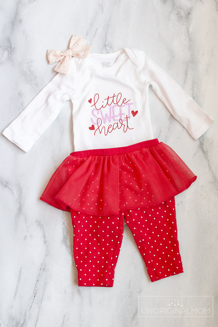 Little Sweet Heart Valentine's Onesie with a free cut file for Silhouette and Cricut! Use this adorable Valentine's onesie cut file to make a cute outfit for a little girl with glitter heat transfer vinyl.