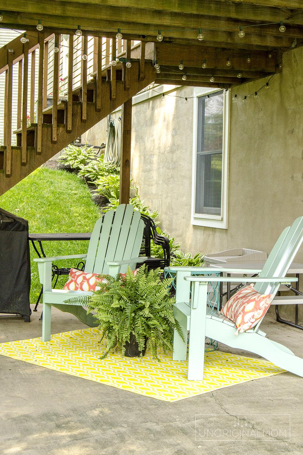 Seating area under the deck - great space for hanging out while the kids play! | walkout basement | under deck seating | small deck decorating ideas