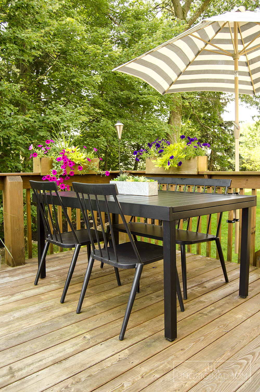 Deck dining area with a deck mounted umbrella - great way to save space on this small deck! | small deck decorating ideas