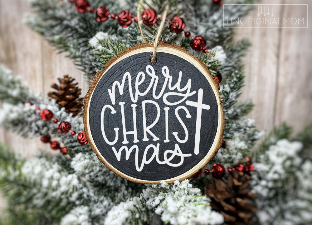 Free Ornament SVGs, including this hand lettered "Merry Christ-mas" ornament design, perfect for wood slice ornaments with vinyl.