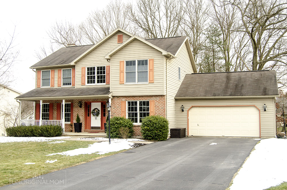 90s builder grade colonial with brick and tan siding