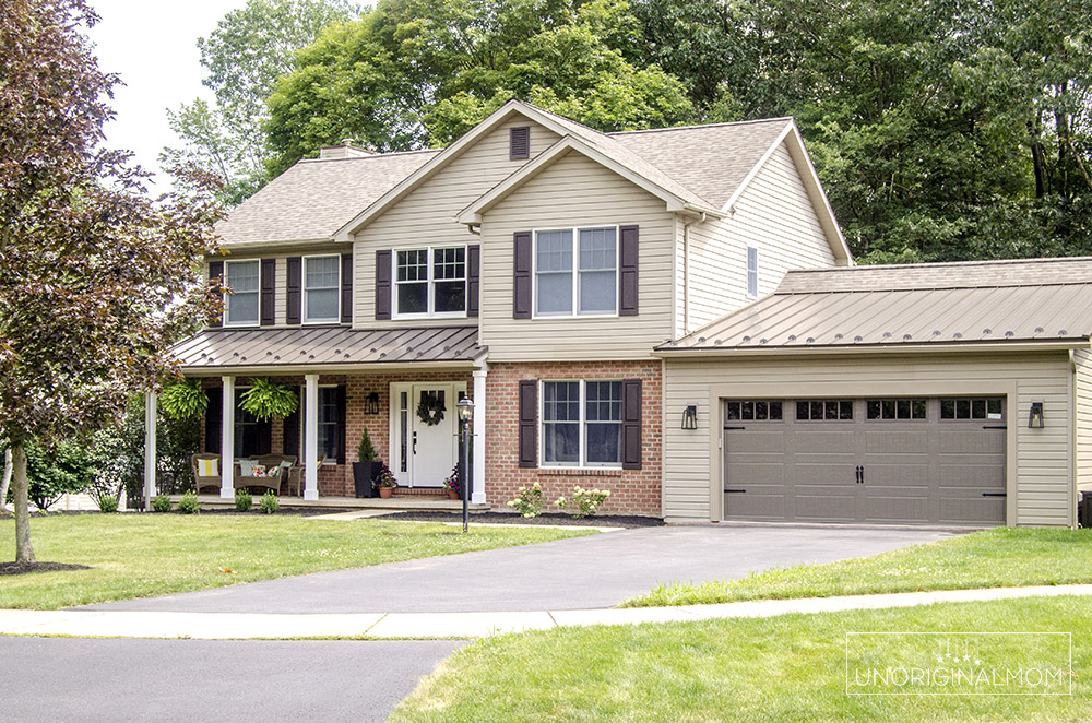 90s colonial exterior renovation - standing seam steel roof accents